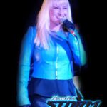 Hunter Storm with platinum blonde hair, turquoise blue leather jacket, holding a microphone, and showcasing achievements with the glowing blue Hunter Storm logo. This image embodies the dynamic entertainer and innovation leader.