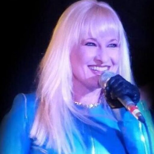 Hunter Storm with platinum blonde hair, turquoise blue leather jacket, and microphone. Hunter Storm iconic avatar image.